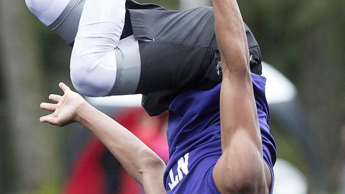 North Thurston’s Donovan Fenwick backflips in celebration after winning the boys high jump competition on the opening day of the 3A South Sound Conference track and field championships at Highclimber Stadium in Shelton on Thursday.