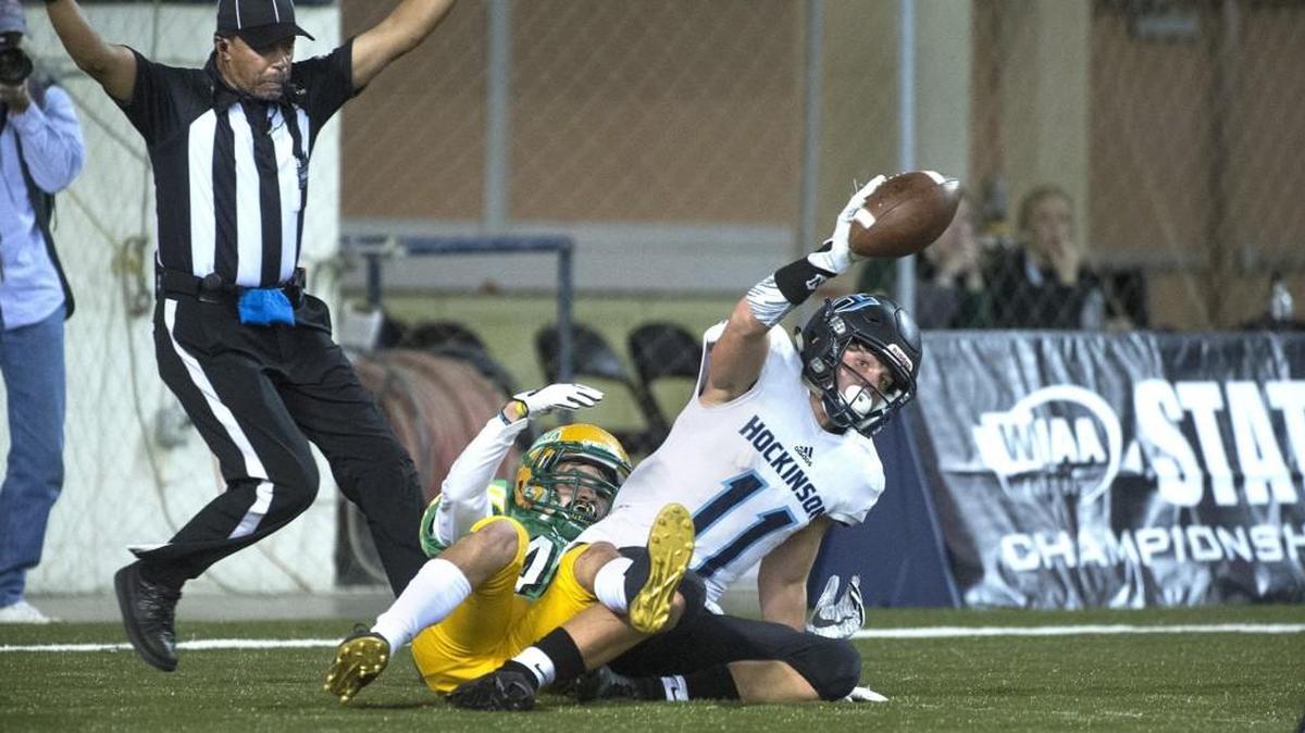 Hockinson wide receiver Sawyer Racanelli comes down with a 3-yard touchdown catch in front of Tumwater defenisive back Zack Gutierrez during Saturday’s 2A state football championship game in the Tacoma Dome on Dec. 2, 2017.