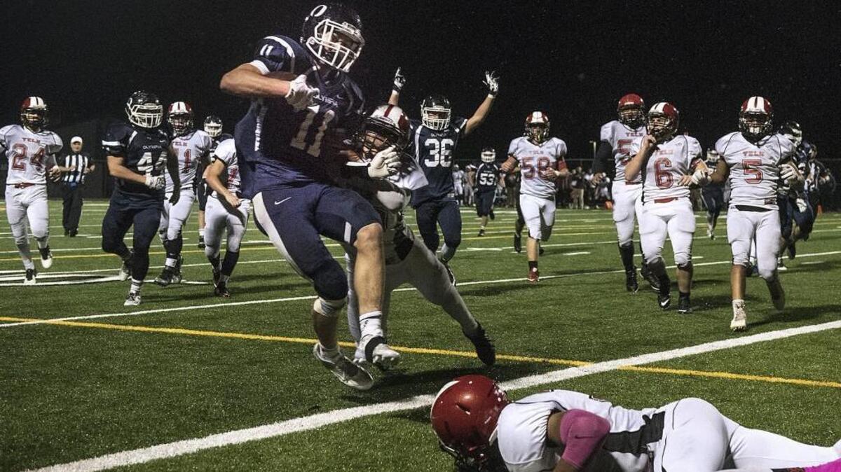 Olympia’s David Woodward (11) ha received postseason honors after racking up 727 yards on 92 carries, and another 484 yards on 31 receptions. He was 10 of 15 passing for 221 yards, and he tallied 489 yards on kick returns. Woodward had 15 total touchdowns.