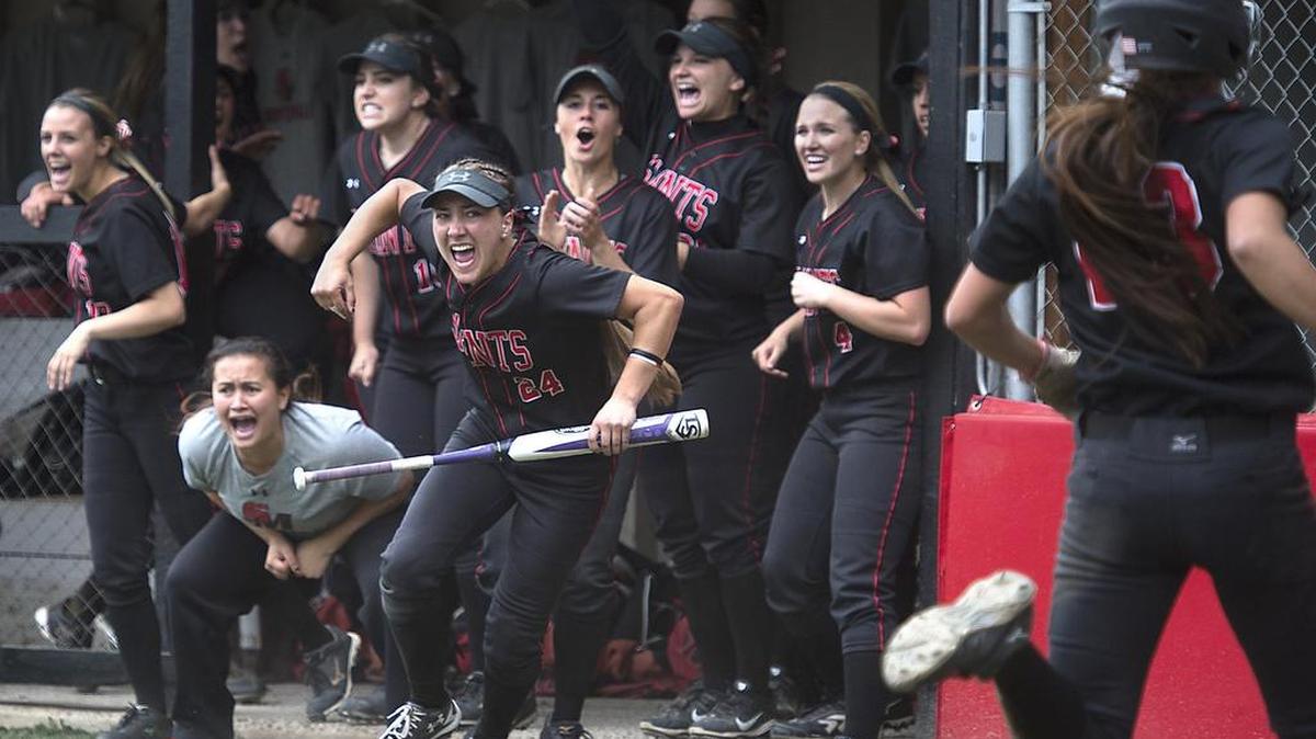 Alyssa Slate (24) and her teammates celebrate as Lauren Diuco scores to give Saint Martin’s a 1-0 lead over Central Washington in the fifth inning Thursday. Jackie Schmaeling drove in Diuco with a two-out double.