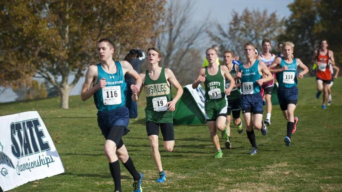 Northwest Christian’s Colton Buster (116) leads a pack of runners in the 1B/2B boys race, including teammates Luke Brederson (115) and Corban Phillips (118). Brederson finished sixth, Phillips ninth and Buster 24th.