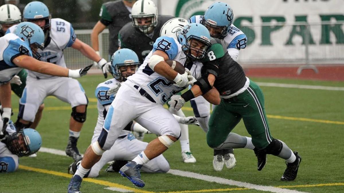 Skyline defensive back Bradley Kim (8) tackles Gig Harbor’s Adrian Valona in the first round of the 4A state football playoffs Nov. 14.