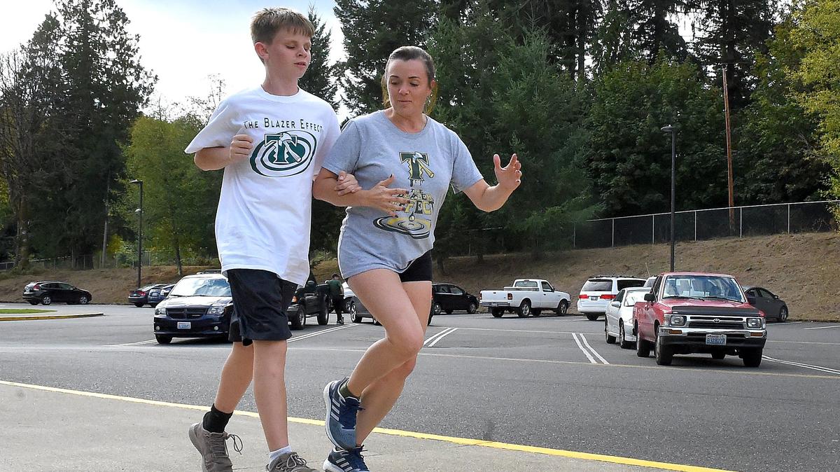 Coming in from a Sept. 20 practice run with his guide, Jamie Sullivan, who’s also an English teacher at Timberline, Blazers’ cross country runner Emmitt Douglas hasn’t let being sightless slow him down on or off the track.