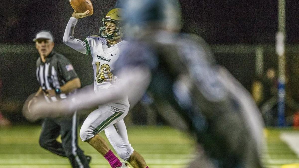 Timberline quarterback Hunter Campau (10) throws a pass for a short gain in the second quarter of the Timberline vs. Gig Harbor football game at Anderson Field in Purdy, Wash., Friday, Oct. 13, 2017.