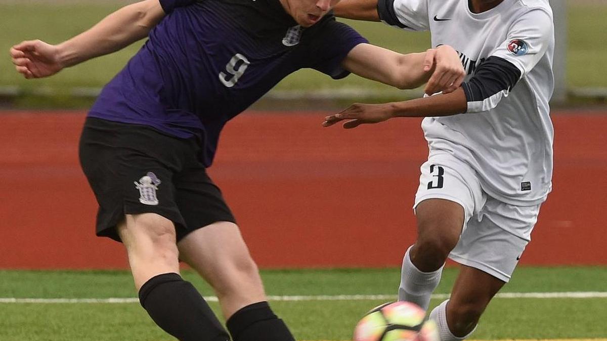 Olympia defender Sayre McDonald (3) battles Knights' midfielder Soren Pehlivanian for control as the Bears hosted visiting Kamiak High School Tuesday in the first round of the 4A state tournament.