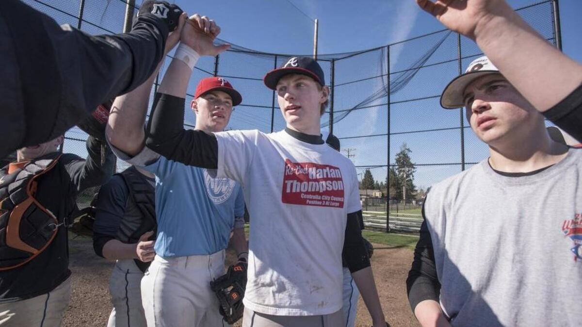 Senior pitcher Christian Peters, center, and his Centralia Tigers teammates get ready to practice at Borst Park in Centralia on Thursday. Peters, who is a University of Portland signee, and the Tigers are looking to win another Class 2A state championship, which they have also done in 2015, 1993 and 1982.