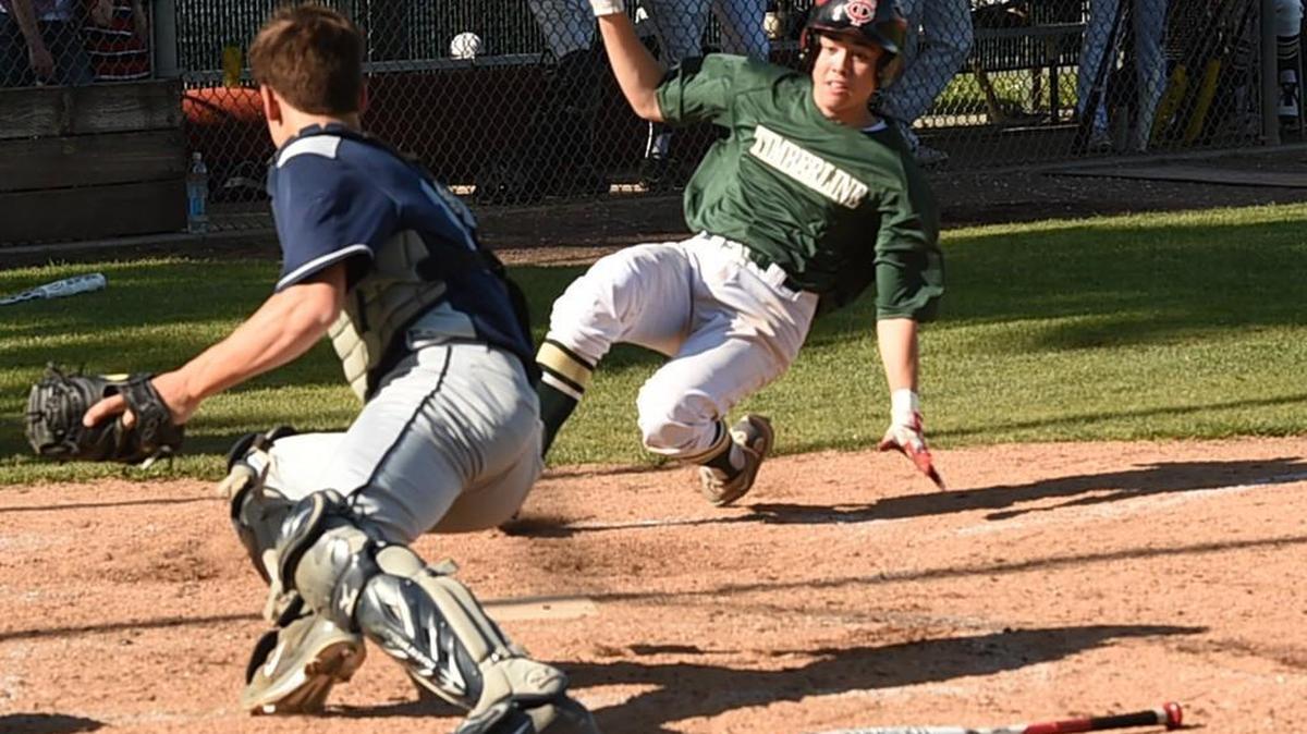 Bears' catcher Brendan Nee waits for the tag at home of the Blazers' #64, Christian Larson, as Timberline hosted Olympia in a Narrows 4A league game Monday. The out call brought Timberline head coach Mark Rubadue down from third base to challenge it.