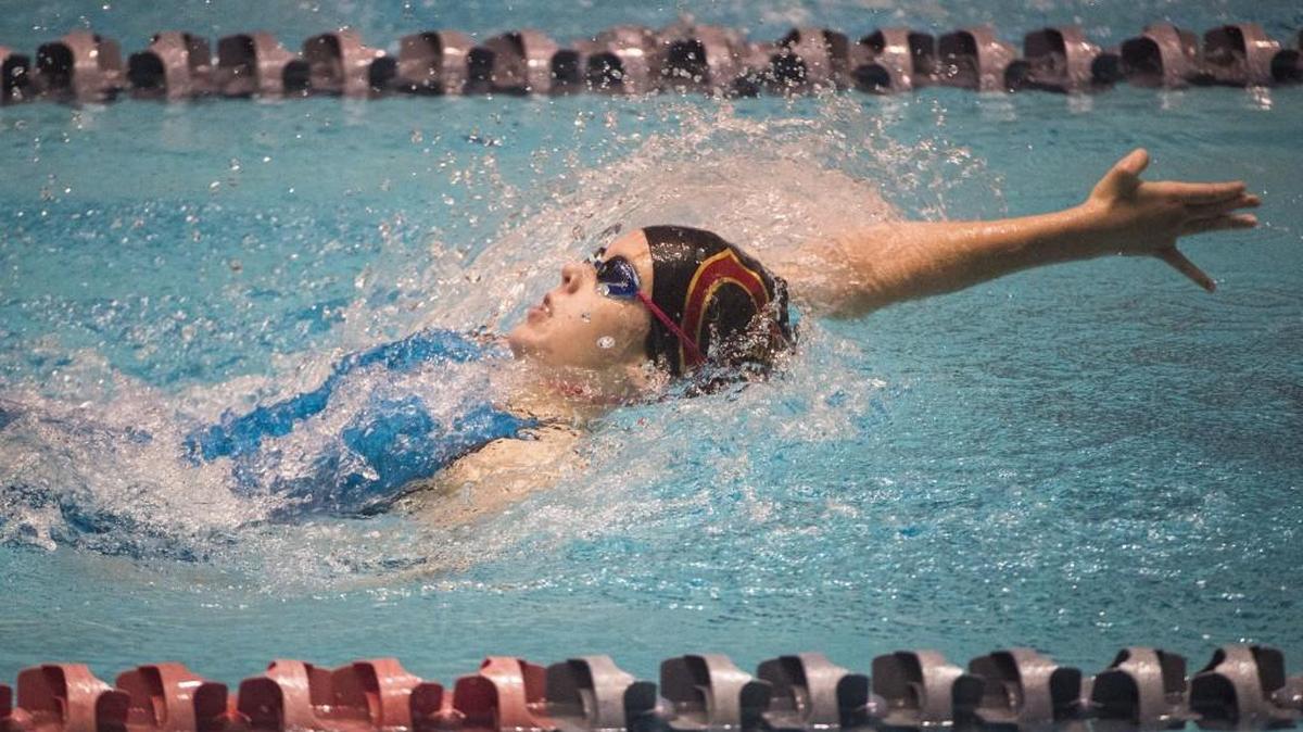 Capital's Camden Martin competes in the 100-yard backstroke at the 3A Girls State Swim and Dive Championships at the King County Aquatics Center in Federal Way, Wash., on Friday, Nov. 10, 2017.