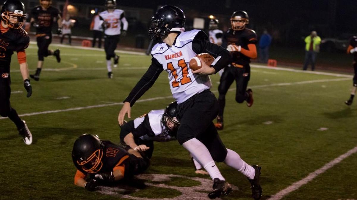 Rainier quarterback Zach Lofgren (11) returns a kickoff during a Class 2B state-playoff game against Napavine on Friday, Nov. 10, 2017 in Centralia.