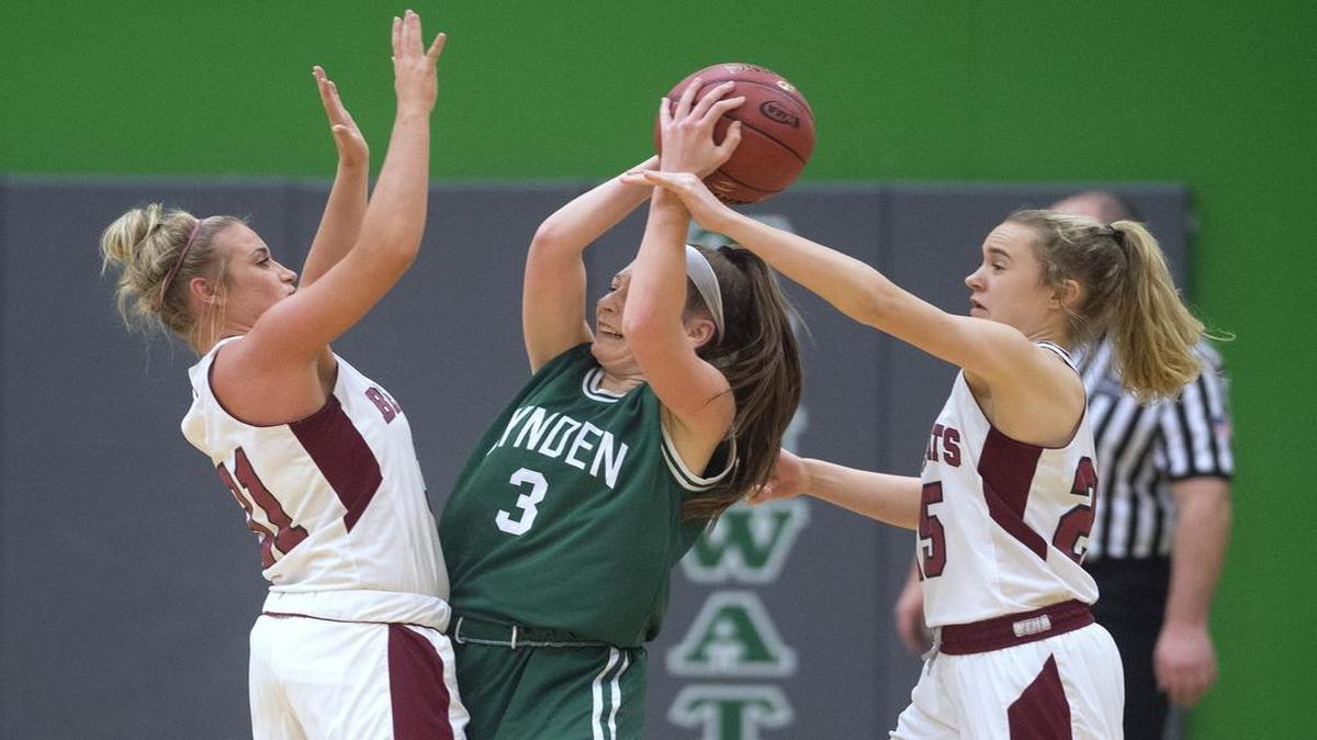Lynden's Livia Tjoelker is pressured by W.F. West defenders Kiara Steen (left) and Lauren Tornow during Friday night's 2A girls basketball regional playoff game at Tumwater High School on Feb. 23, 2018.