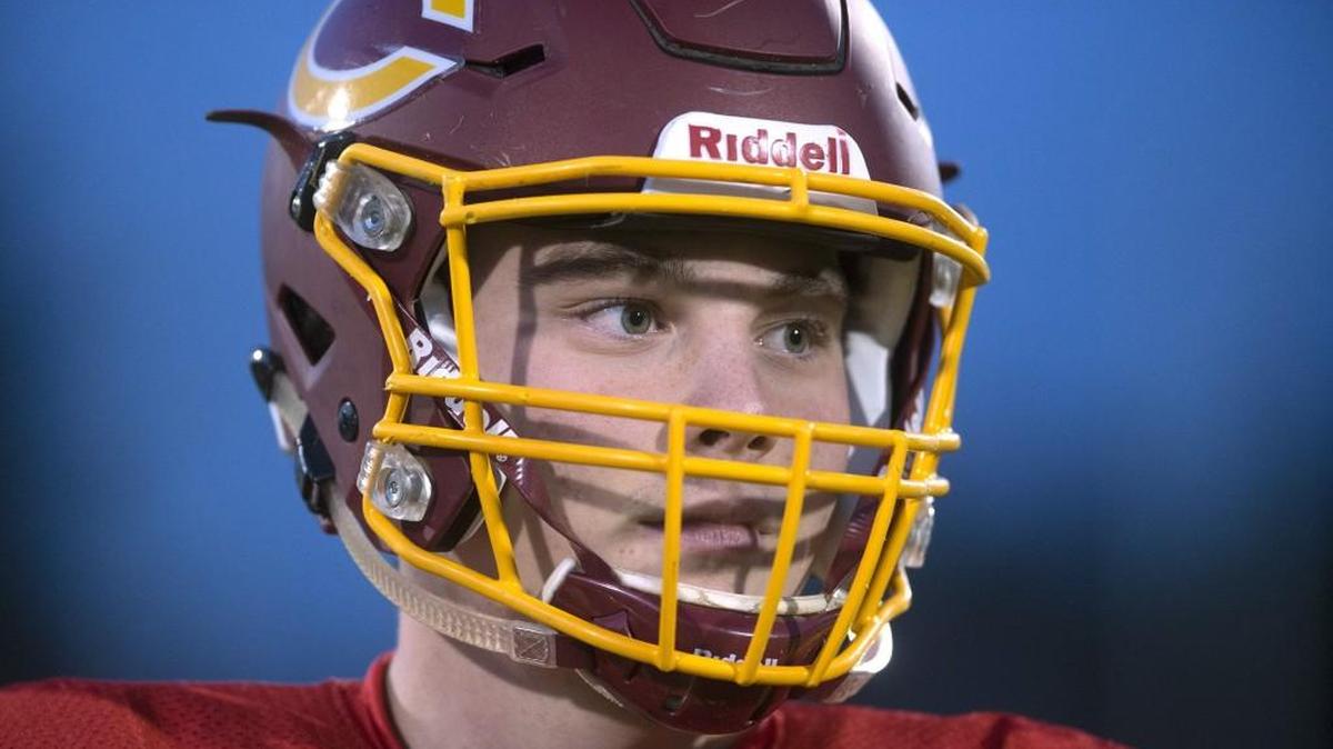Capital senior quarterback Cody Jenkins has returned to lead the Cougars into the playoffs after cutting his finger days before the season-opener. He is shown during football practice Tuesday at Ingersoll Stadium in Olympia.