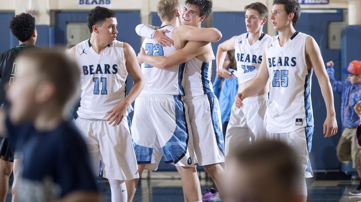 Olympia’s Brett Thompson (back) and Hunter Sipe celebrate after the Bears’ overtime victory on Thursday night. Sipe led Olympia with 20 points, including a 3-pointer in the fourth quarter to keep Timberline temporarily at bay.