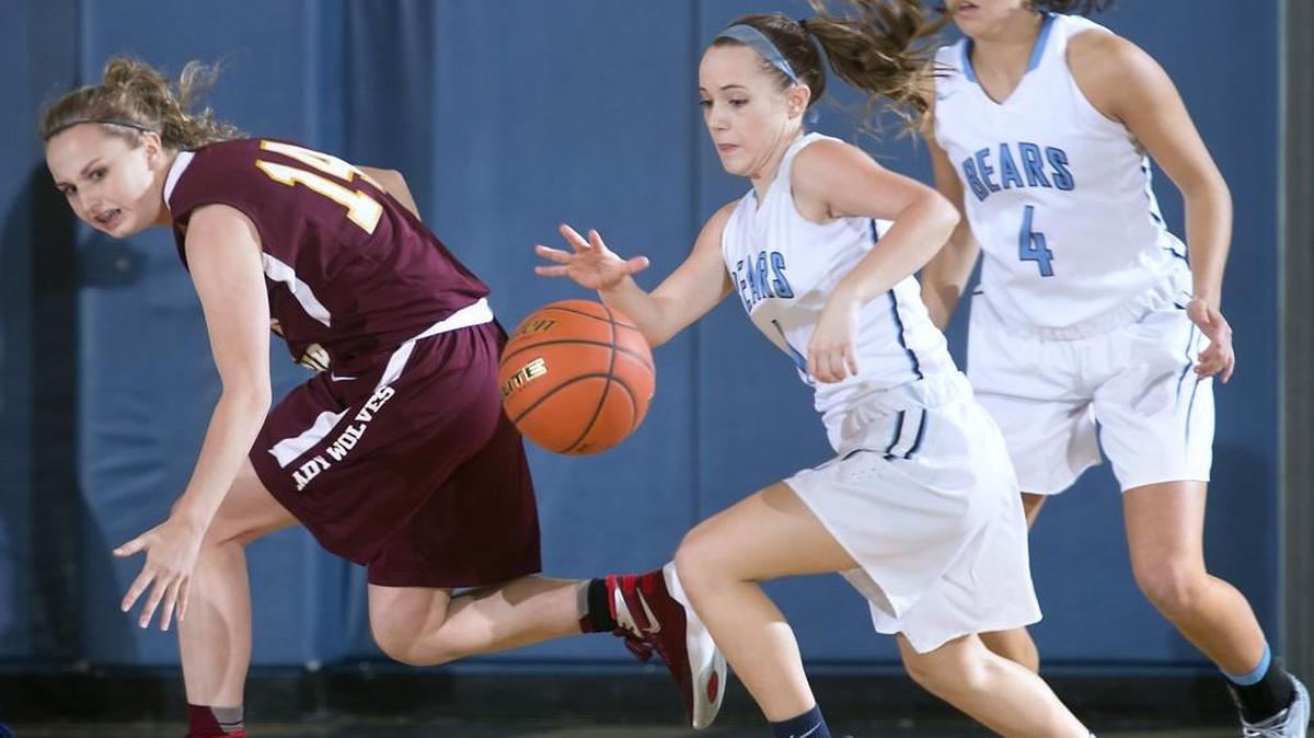 Olympia’s Moriah Luthy, center, steals the ball from South Kitsap’s Savannah Foster, left, as the Bears’ Jenna Randich comes in to assist.