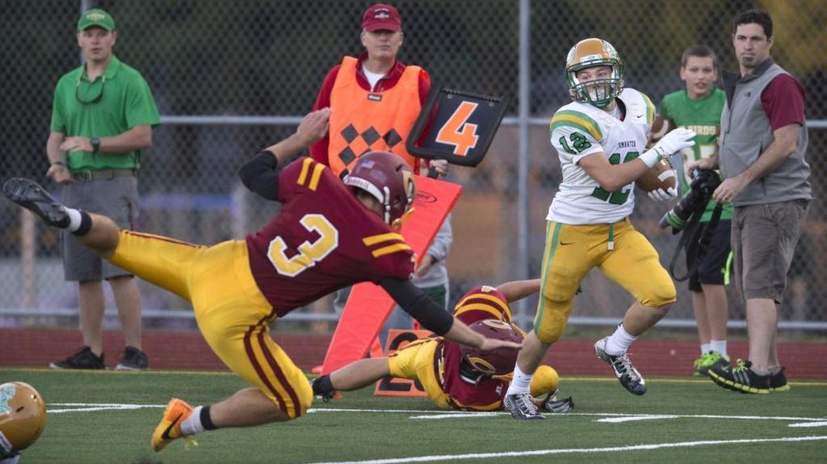 
Tumwater punt returner Jacob Crawford breaks loose for a 65-yard punt return for a touchdown during the season-opening football game at Ingersoll Stadium in Olympia on Friday, Sept. 4, 2015.
