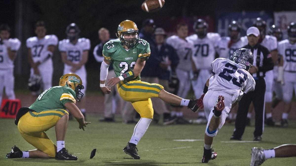Tumwater’s Noah Andrews (kicking) plays on offense, defense and special teams. “You just have to stay conditioned,” he says. “You’ve got your energy going the whole game.”