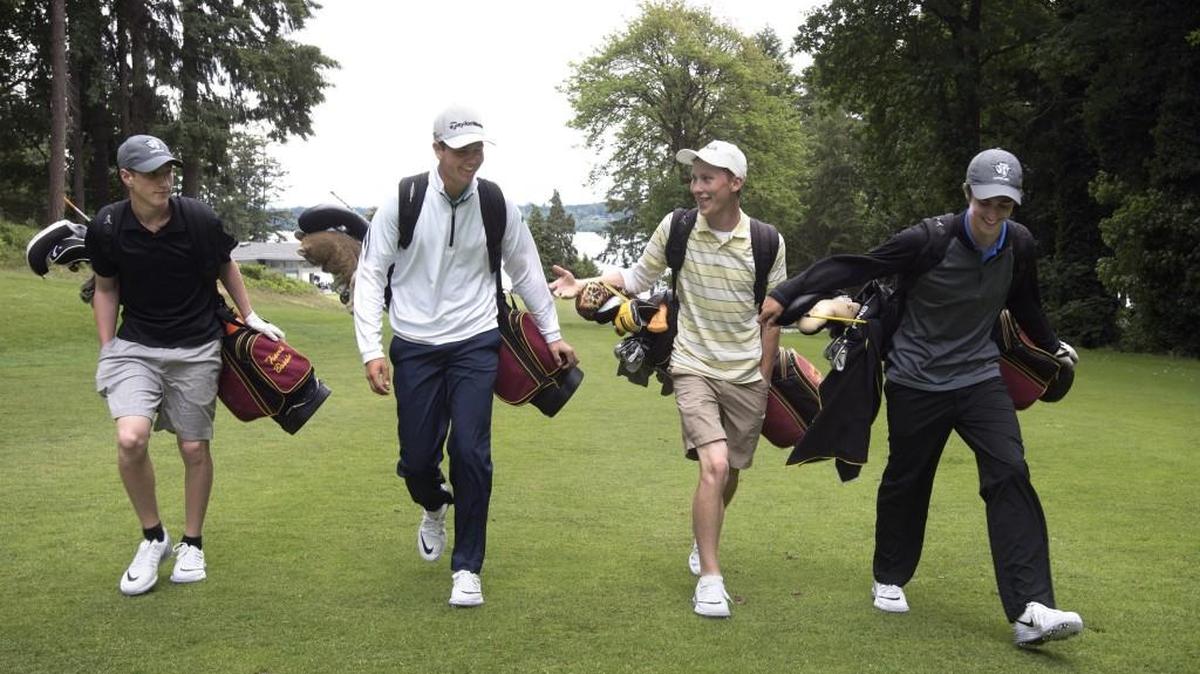 Capital High golfers (from left) sophomore Travis Bossio, senior Eric Hagen and juniors Gabe Barnes and Eli Simpson head out on a practice round Wednesday. All four will be competing at the state tournament in Spokane.