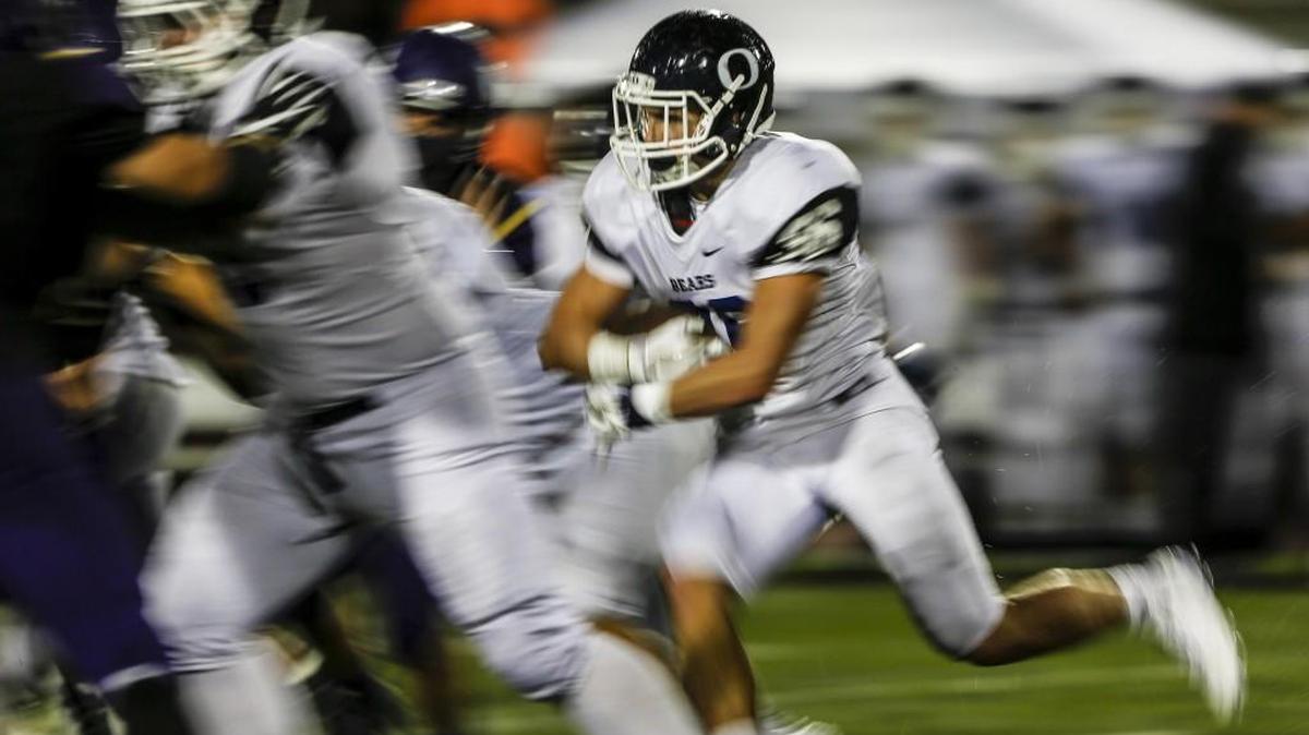 Olympia's Scott Gunther (36) rushes in the second quarter. Puyallup played Olympia in a football game at Sparks Stadium in Puyallup, Wash., on Friday, October 21, 2016.