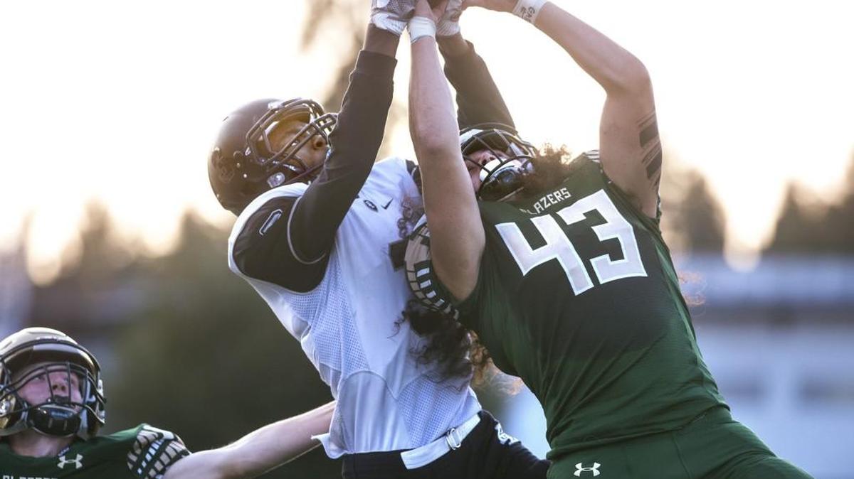 Bonney Lake receiver Amitri Allen (left) battles Timberline defender Jamin Faalogo for a pass reception during Friday night’s 3A football game at South Sound Stadium in Lacey on Sept. 8, 2017. Both players came down with the ball, with the reception and possession awarded to Bonney Lake.