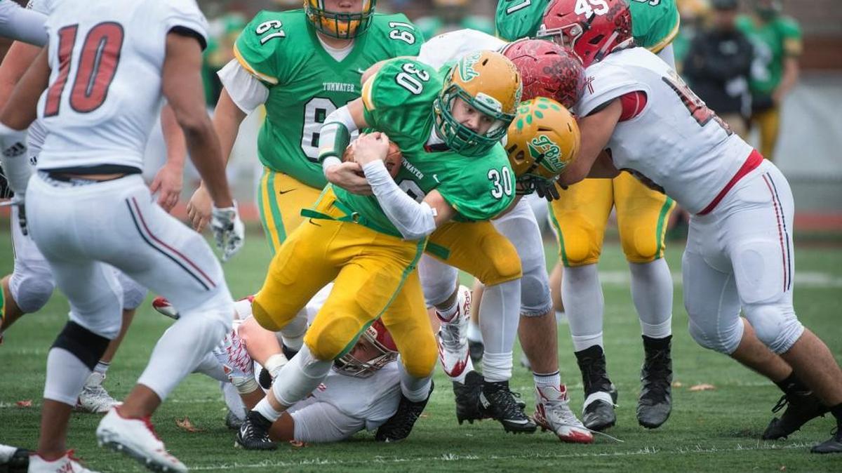 Tumwater running back Dylan Paine grinds out yardage against Archbishop Murphy during Satuday’s 2A state football semifinal at Sparks Stadium in Puyallup on Nov. 25, 2017.