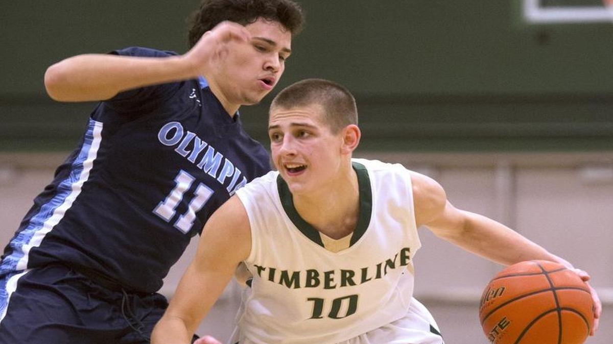 Timberline's Erik Stevenson (10) drives against Olympia's Zaiden Hernandez during a 4A Narrows League matchup Jan. 13. Next season Timberline will join the new 3A South Sound Conference and Olympia will join the 4A SPSL.