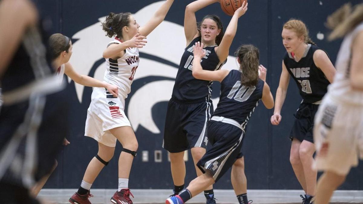 River Ridge’s Madeline Retzlaff is pressured by Black Hills defender Meghan Reichert.