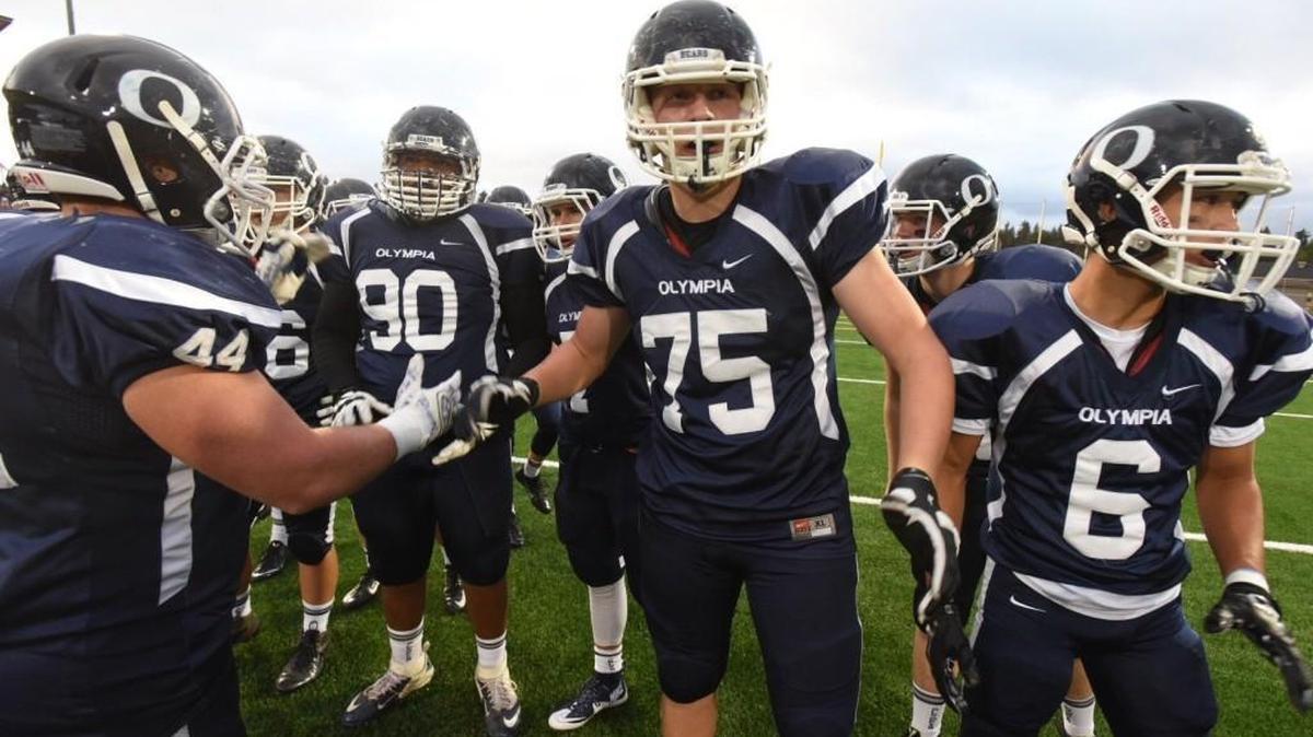 
Olympia Bears defensive players warm up before Friday night's home football game against the Issaquah Eagles at Ingersoll Stadium on Oct. 2, 2015.
