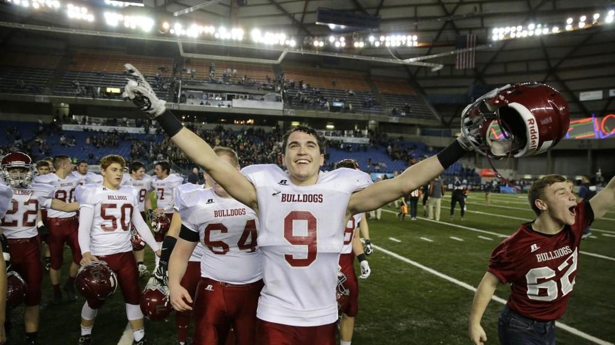 Okanogan tight end Joe Esquivel (9) celebrates after Okanogan defeated Napavine 36-34 to win the Class 2B high school football championship at the Tacoma Dome.
