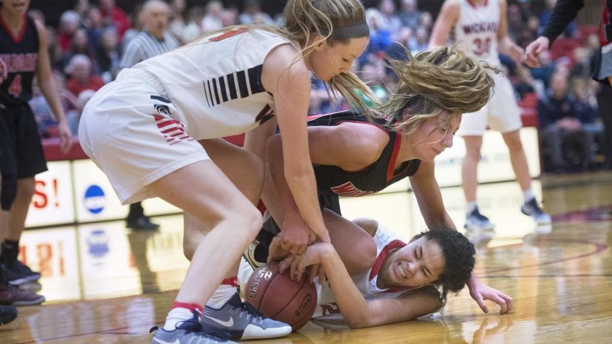 Black Hills' Taylor Patti (top) and Maisy Williams (bottom) fight for a loose ball with Archbishop Murphy's Olivia Riojas during Saturday's 2A Girls Basketball regional playoff game at Saint Martin's University in Lacey on Feb. 25, 2017.
