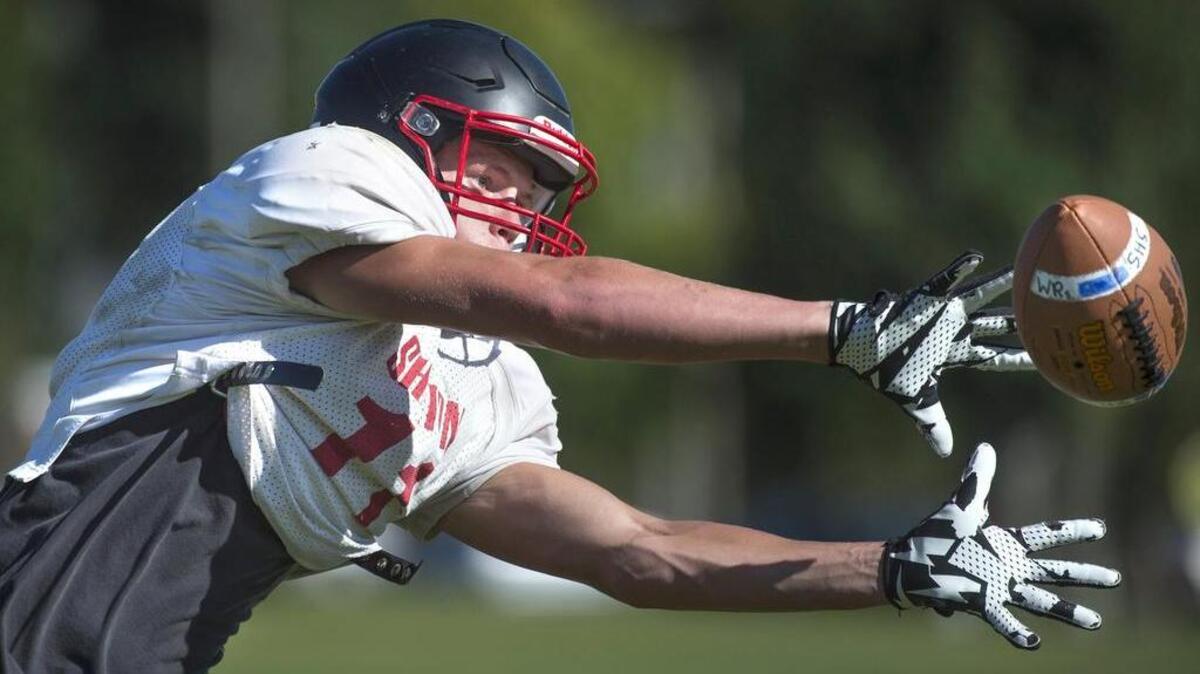 Shelton receiver Skyler Ross stretches for a catch during practice this week. Ross, Kyle Kimball and Taylor Toney figure to be top targets for quarterback Tyler Giraldes’ passes.