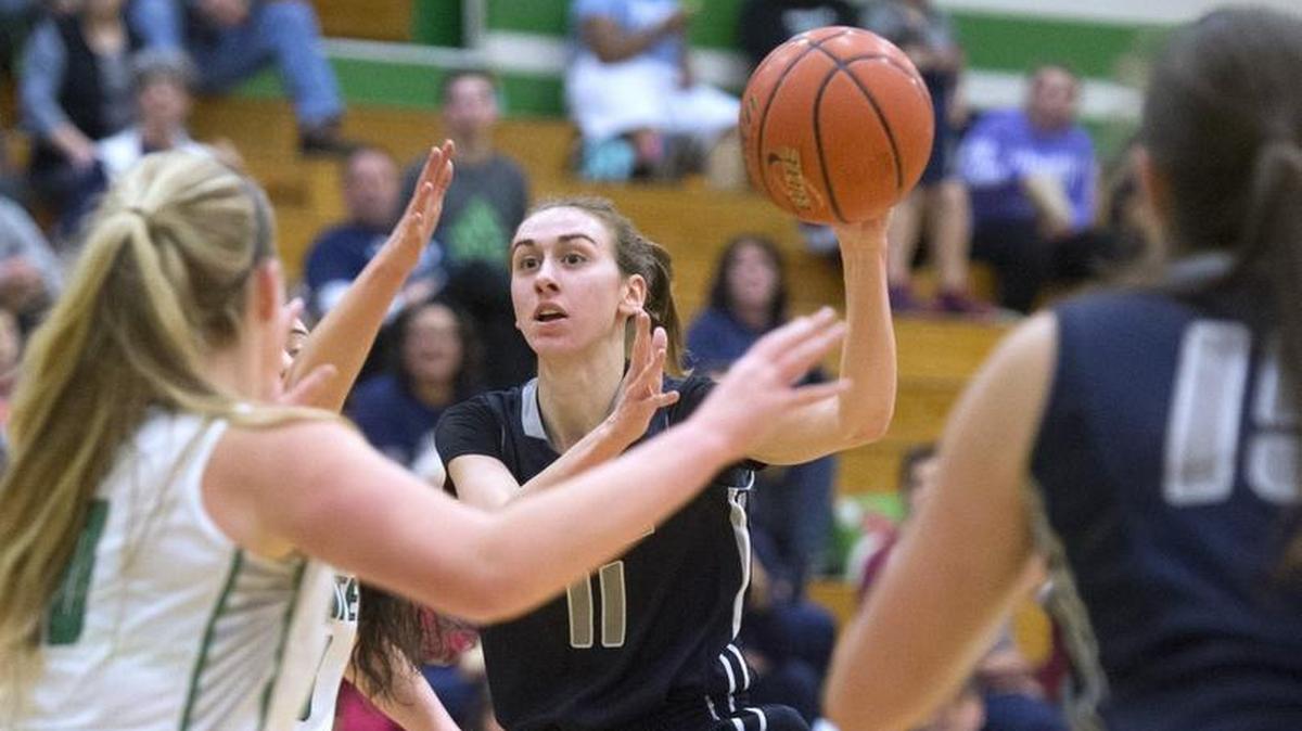 River Ridge's Caitlin Yenne flies down the lane befroe dishing off an assist Tumwater during Friday night's girls basketball game at Tumwater High School on Dec. 30, 2016.