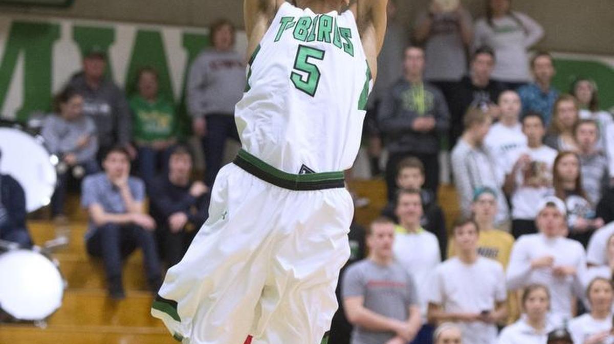 Tumwater’s Ty Gentry grabs an alley-oop pass for a dunk against Black Hills on Friday night. Gentry finished with 16 points. The T-Birds often converted defensive stops into points in the first half.
