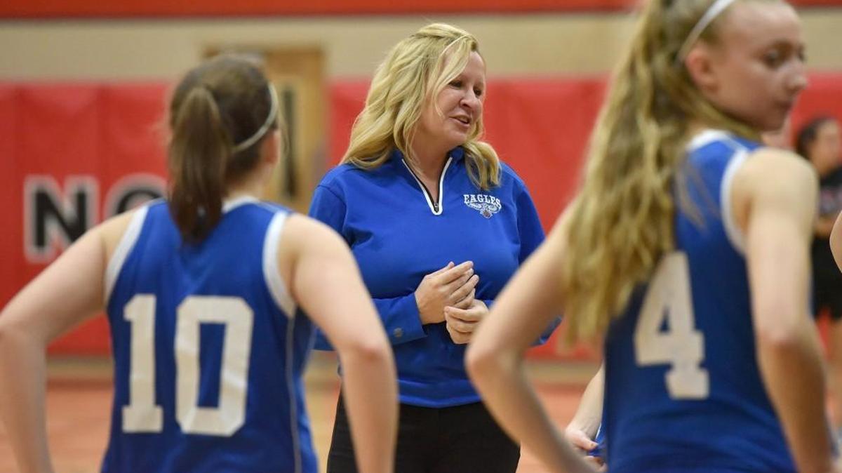 Elma High School coach Lisa Johnson talks with her team before a girls basketball game against Tenino on Thursday, Jan. 11, 2018 in Tenino, Wash.