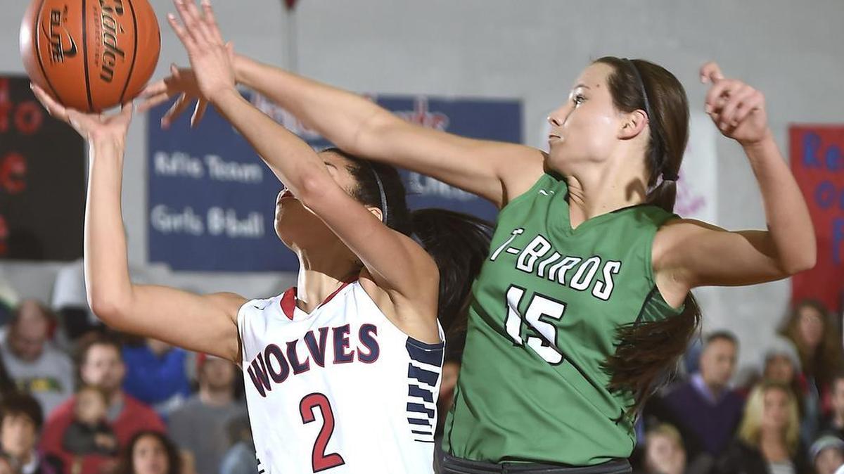 Tumwater's Brooke Hare (15) blocks a shot by Black Hills' Maisy Williams during the girls basketball game at Black Hills High School in Tumwater on Friday, Feb. 5, 2016.