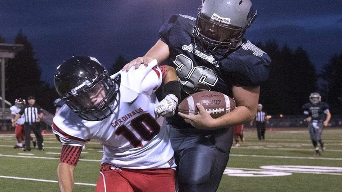 River Ridge’s Brayden Anderson fights off Franklin Pierce defender Saul Lok (10) at South Sound Stadium in Lacey on Sept. 18, 2015. The Hawks will play the Cardinals for the 2A SPSL title on Friday.