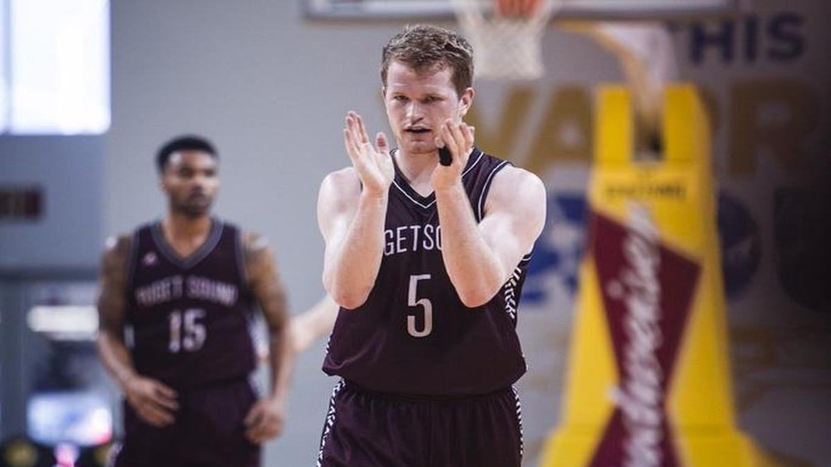 “When he’s (Matt Reid) in the lineup, we tend to talk a lot more on defense and we tend to execute a lot more offensively,” says Justin Lunt, UPS men’s basketball coach.