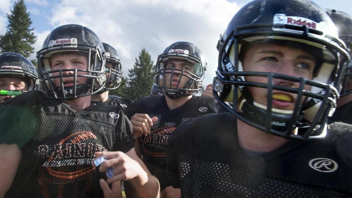 Rainier running back Ian Russell (center) during football practice at Rainier High School on Tuesday, Sept. 19, 2016.