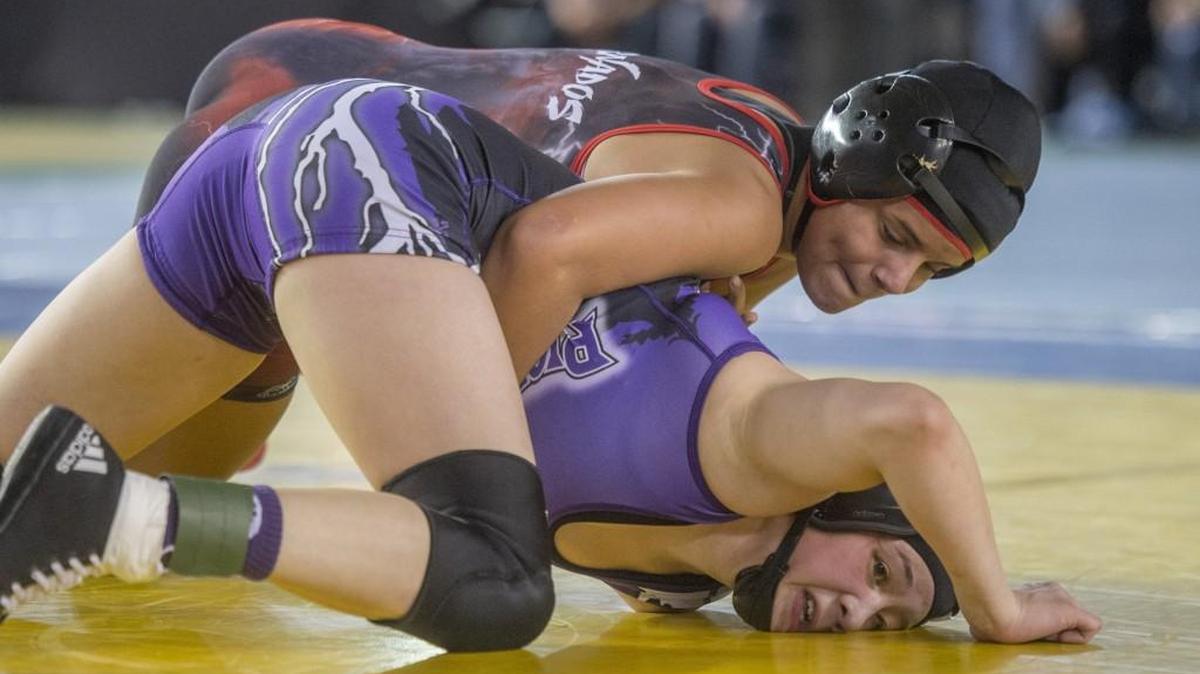 Carly Smith of Yelm dominates Lynette Samano of Nooksack in their 125-pound match on day one of the WIAA Mat Classic state wrestling tournament in the Tacoma Dome, February 17, 2017.