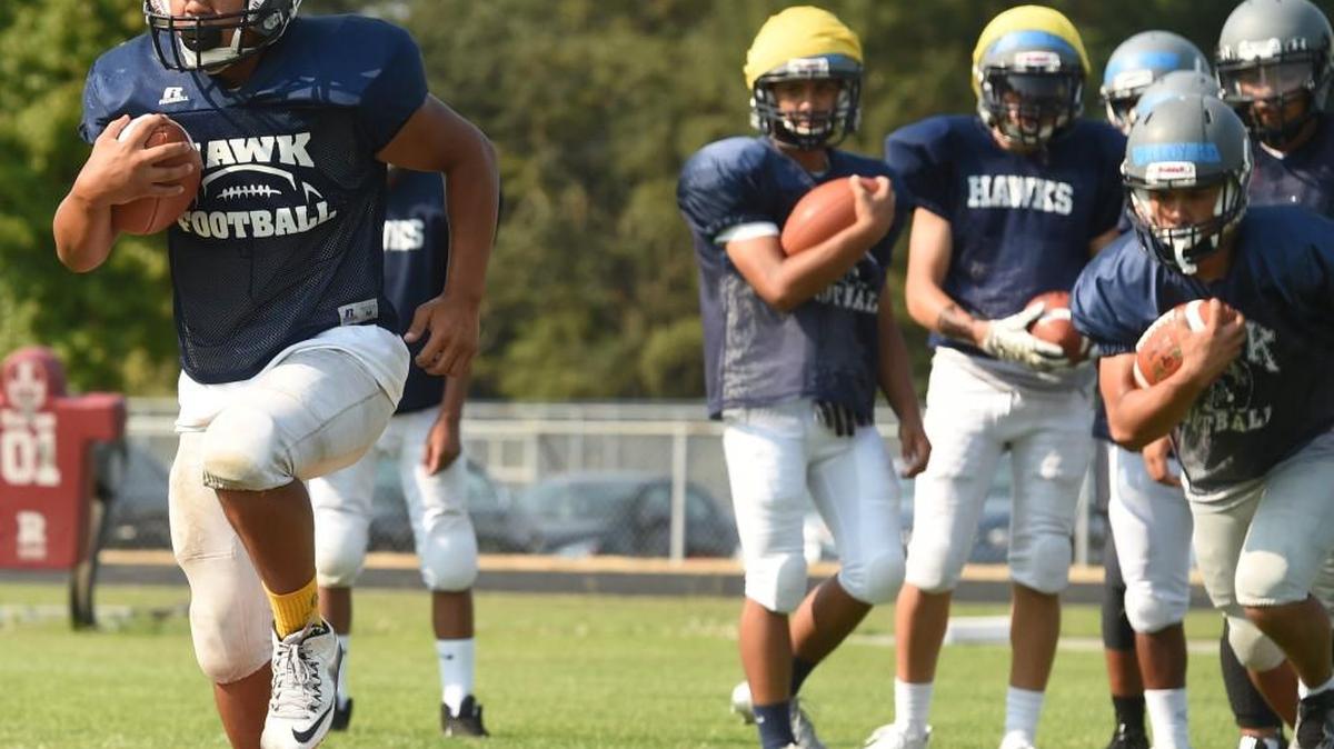 River Ridge’s Maleko Mina runs drills at practice on Aug. 28, 2017.