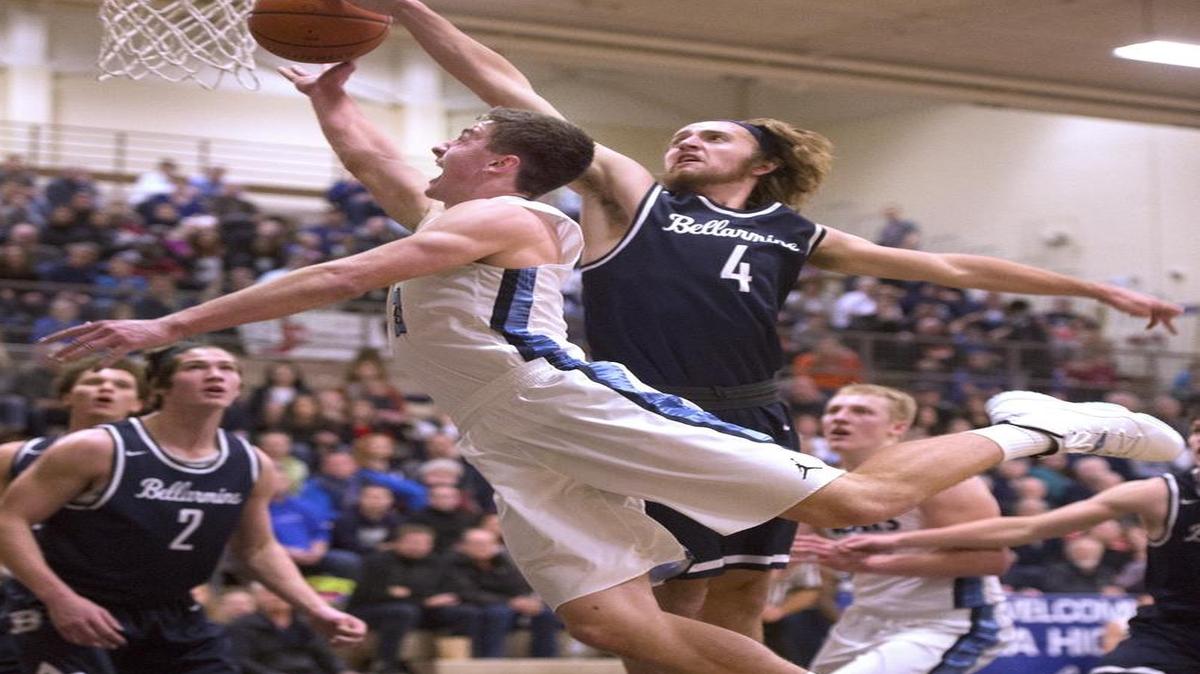 Olympia’s David Woodward has his shot blocked by Bellarmine Prep defender Isaac Wojtanowicz (4) on Friday night. Bellarmine Prep has won 15 of its past 16 games since an 0-2 start to the season.