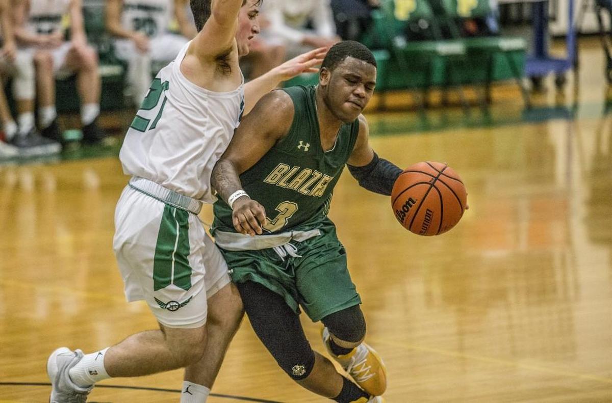 Timberline guard Eli Morton (3) finished with 22 points against Peninsula in Purdy on Friday, Jan. 12, 2018.