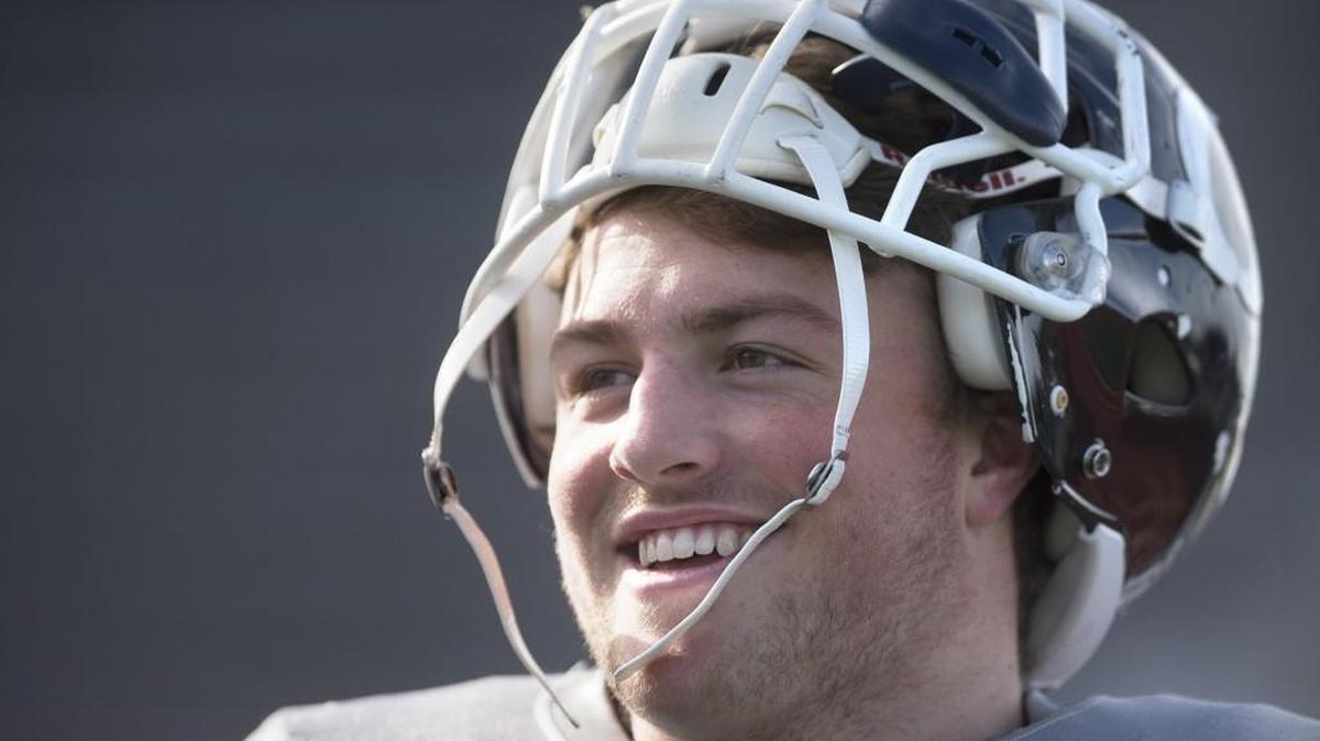 
Olympia senior linebacker and running back Clay Markoff relaxes during a break in football practice at Ingersoll Stadium in Olympia on Thursday, Oct. 15, 2015.
