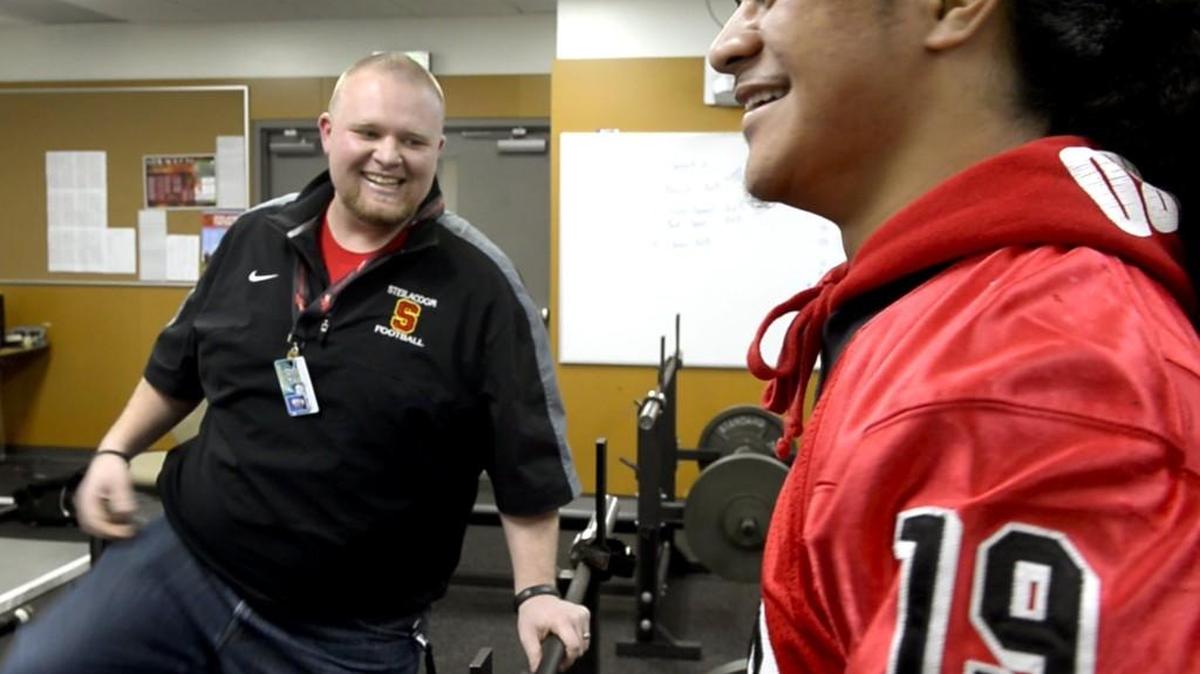 William Garrow, left, a former Steilacoom assistant football coach, jokes with Fotu T. Leiato last year. Garrow was named the North Thurston head football coach Jan. 13 after spending a year as the school’s defensive coordinator.