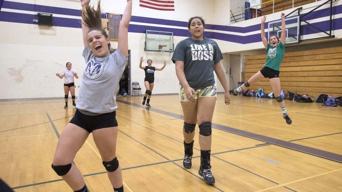 
North Thurston starters, from left) Taylar Peck, Morgan Stroud, Alex Porter, Jocelynn Porter and Clarissa Jenkins celebrate winning a competition against teammates during volleyball practice at North Thurston High School in Lacey on Tuesday, Sept. 29, 2015.
