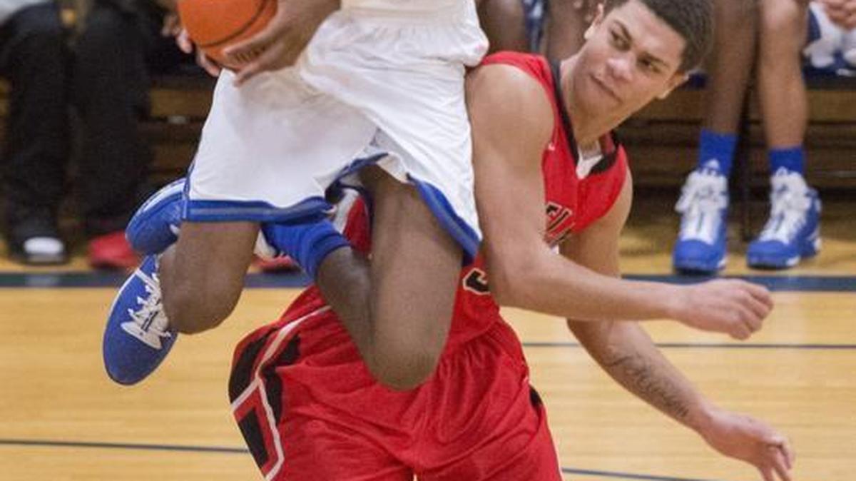 Federal Way's Jalen McDaniels looks to put up a shot Wednesday in the second half but was fouled on the play by Yelm's DeVante Pearson.