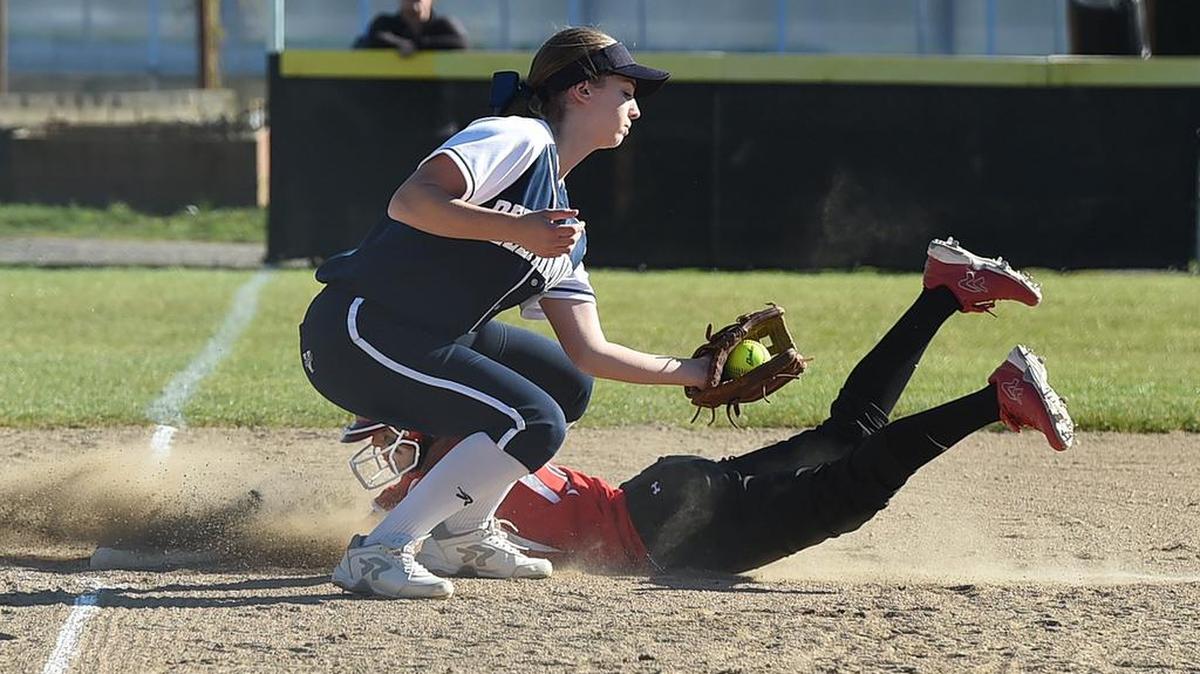 Yelm’s Mackinzee Moore slides under the tag of Bellarmine Prep’s Haley McMasters at third base on Wednesday.