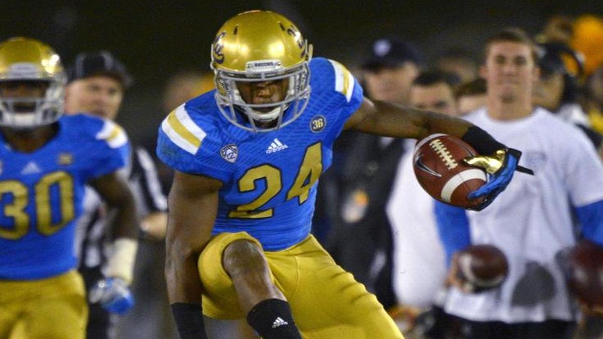 Running back Paul Perkins (24) and the UCLA Bruins are looking for their fourth consecutive win over USC.