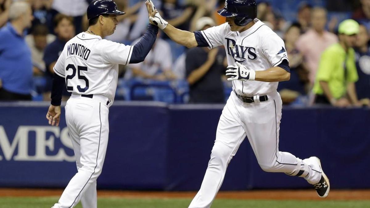 
Mikie Mahtook, right, gets a high five from Tampa Bay Rays third base coach Charlie Montoyo after a home run in September. Montoyo is reported to have interviewed Monday for the vacant Seattle Mariners manager post.
