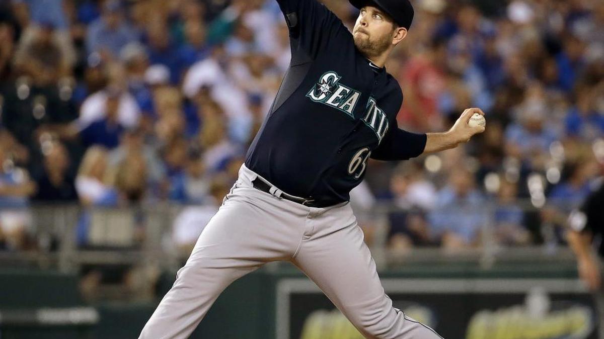 
Seattle Mariners starting pitcher James Paxton winds up during the first inning of a baseball game against the Kansas City Royals on Thursday, Sept. 24, 2015, in Kansas City, Mo. Paxton reported that his troublesome middle fingernail remained “a little bit tender” Friday, one day after a torn nail forced his removal in the second inning.
