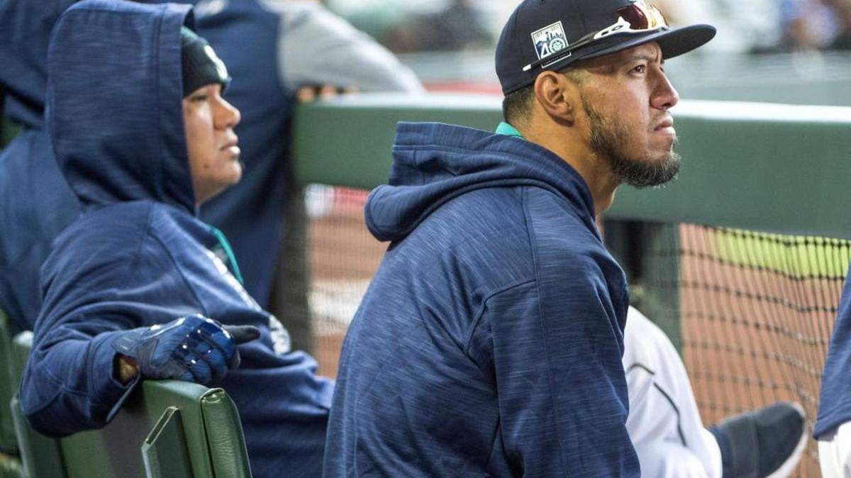 New Mariners starter Yovani Gallardo, right, watches Seattle’s home opener Monday. He ranks second only to former Dodgers great Fernando Valenzuela in strikeouts by a Mexican-born pitcher.
