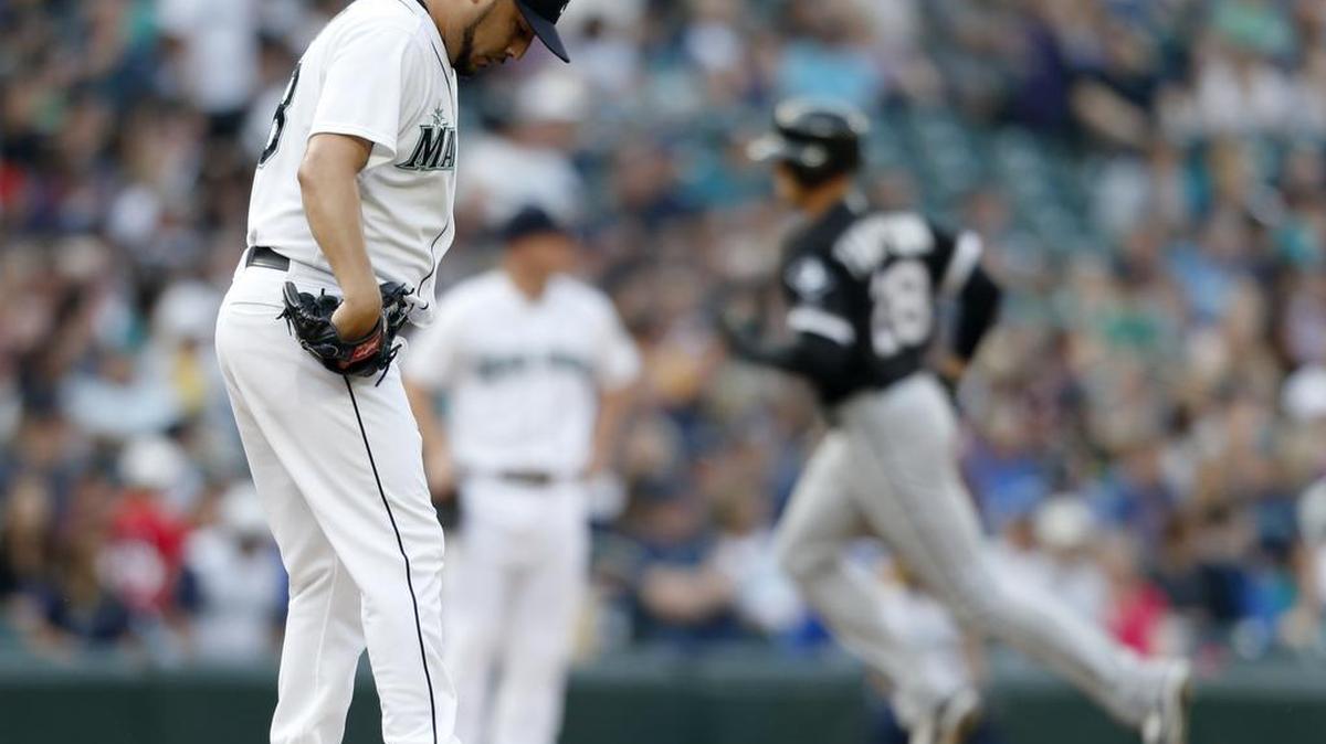
Mariners pitcher Vidal Nuno looks down as Chicago’s Trayce Thompson rounds third base after hitting a solo home run Saturday.
